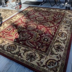 A  hand tuffed area rug. 8 by 10, made in India